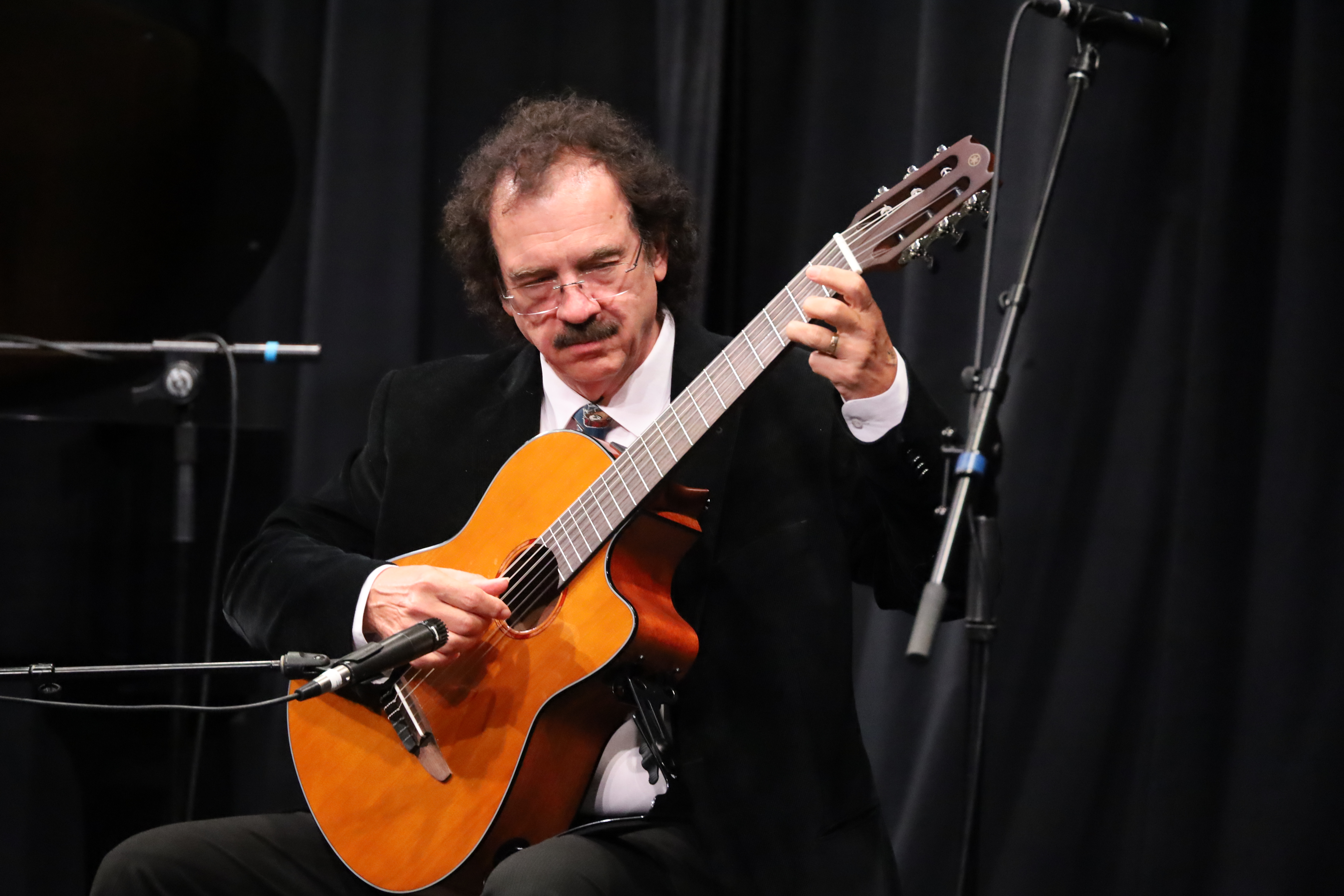 Adult taking a music lesson at SYNERGY Brampton