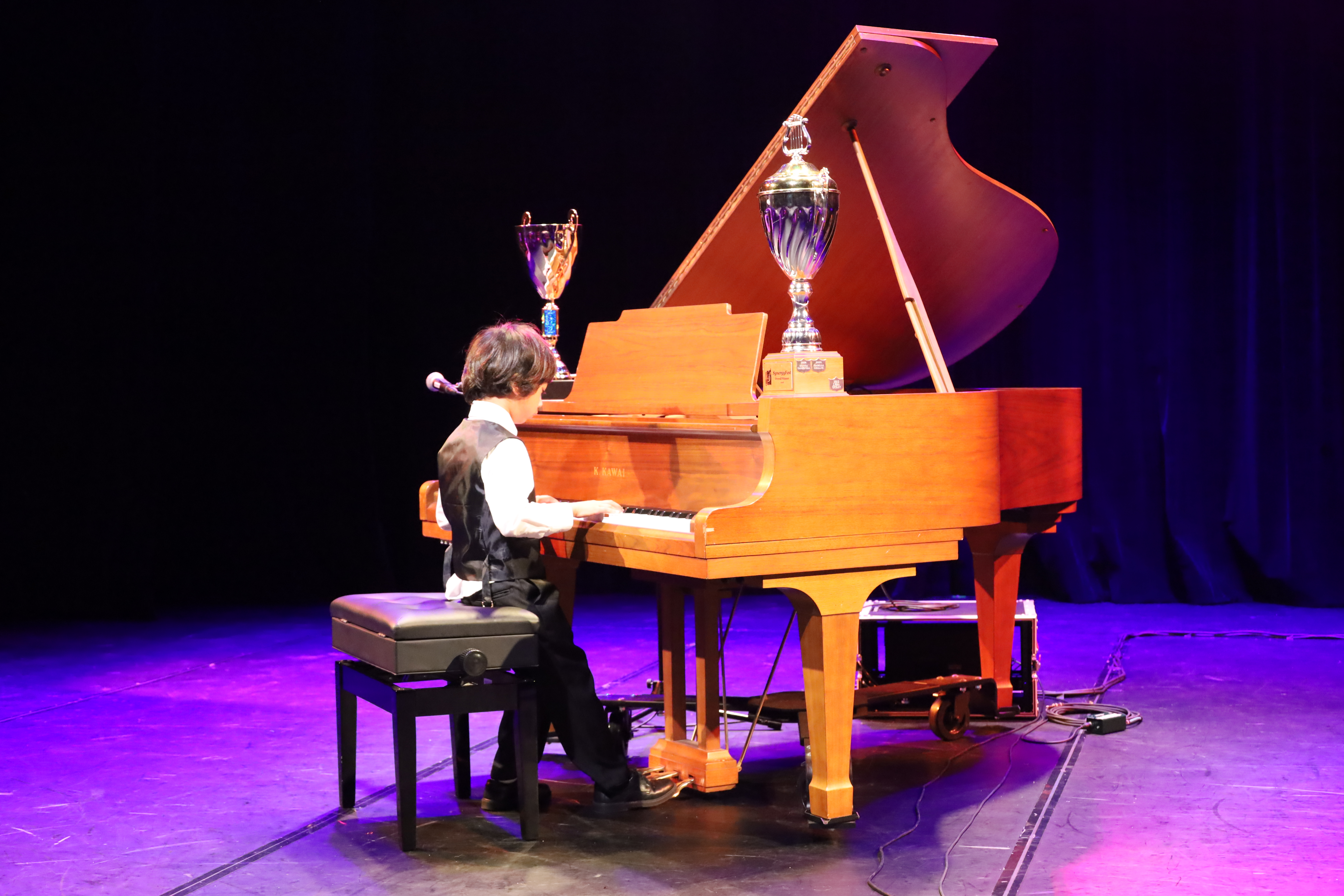 young piano student at recital for Synergy Performing Arts in Brampton