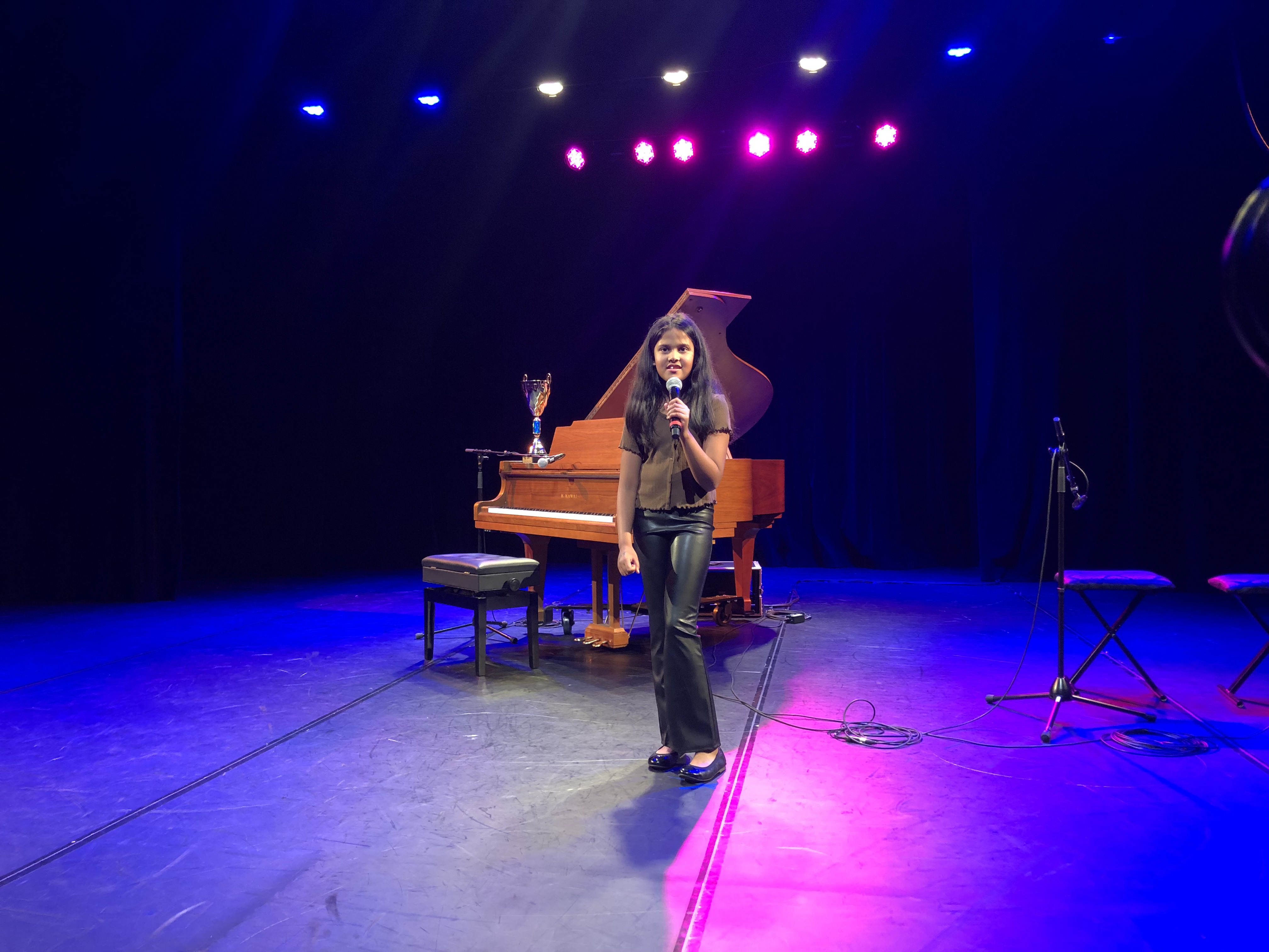 Student singing at recital at Synergy in Brampton